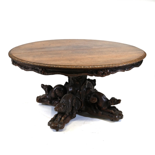 929 - A large Black Forest Hunt Centre Table, c1880s. Constructed in Oak the base has been carved as four ... 