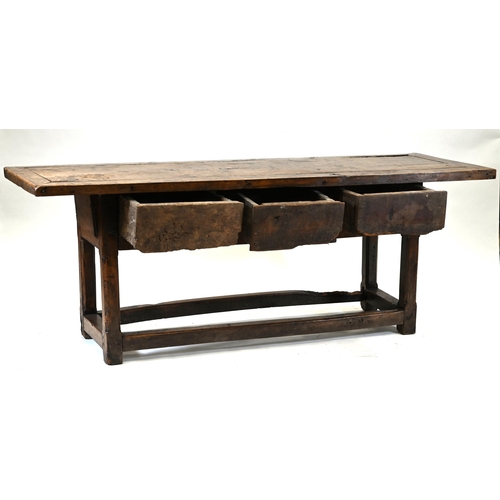 931 - A Country style preparation or scullery table with chamfered legs, rectangular top and three drawers... 