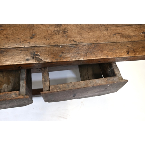 931 - A Country style preparation or scullery table with chamfered legs, rectangular top and three drawers... 