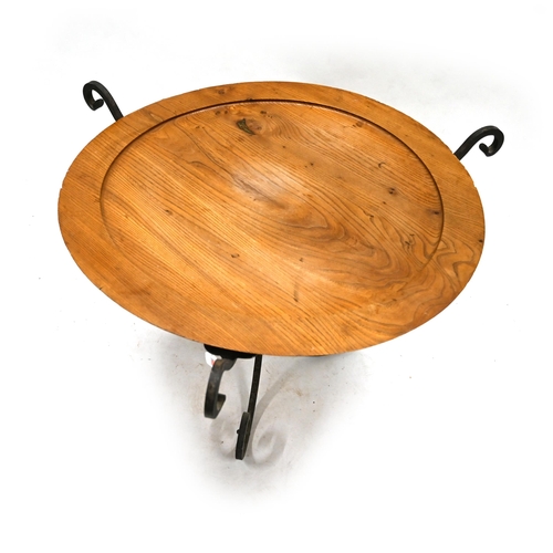 933 - A Mid Century hand wrought iron based coffee table with turned elm top c1950s. Diameter 88cm, H 59cm... 