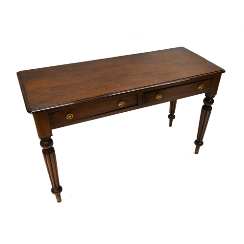 937 - Mid 19th Century Mahogany side table with deep reeded legs and two drawers. W 123cm, D 50cm, H 75cm.