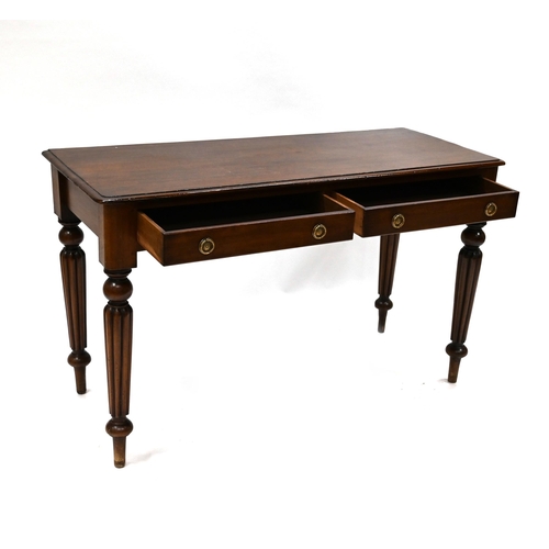 937 - Mid 19th Century Mahogany side table with deep reeded legs and two drawers. W 123cm, D 50cm, H 75cm.