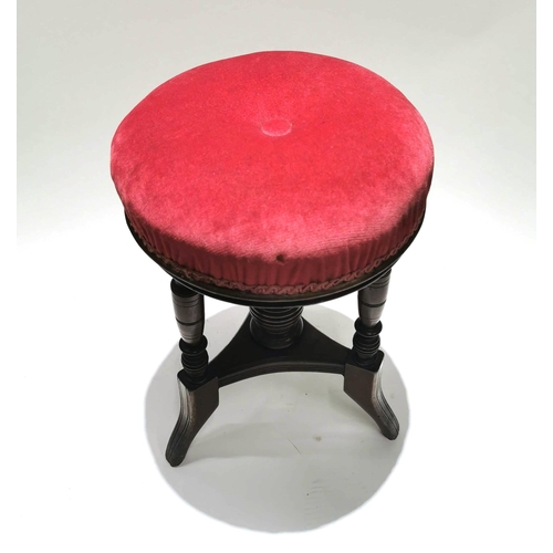 939 - An Aesthetic Period adjustable Mahogany Piano Stool. With upholstered seat and turned spindles, this... 