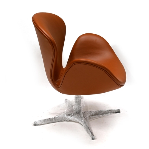 944 - Fritz Hansen Swan Chair in Tan Leather with polished aluminium swivel base. This example manufacture... 