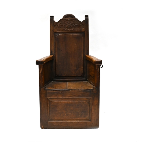 960 - A Continental Lambing Chair constructed in Ash & Elm. Panel sides and back with shallow carved decor... 