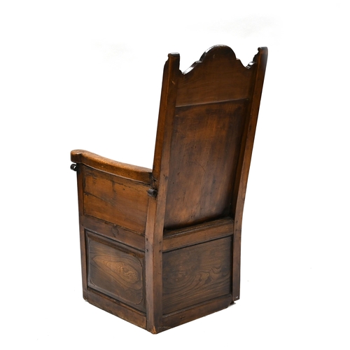 960 - A Continental Lambing Chair constructed in Ash & Elm. Panel sides and back with shallow carved decor... 