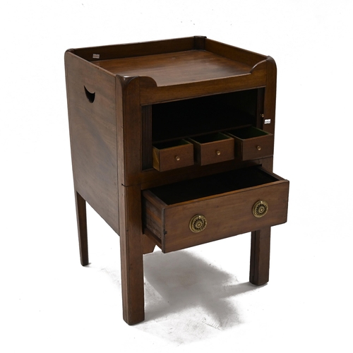 968 - A Georgian mahogany night stand with galleried top over a tambour door opening to reveal a cupboard ... 