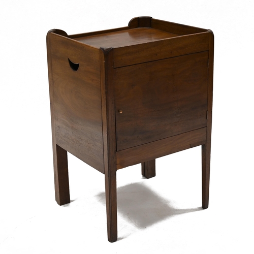 968 - A Georgian mahogany night stand with galleried top over a tambour door opening to reveal a cupboard ... 