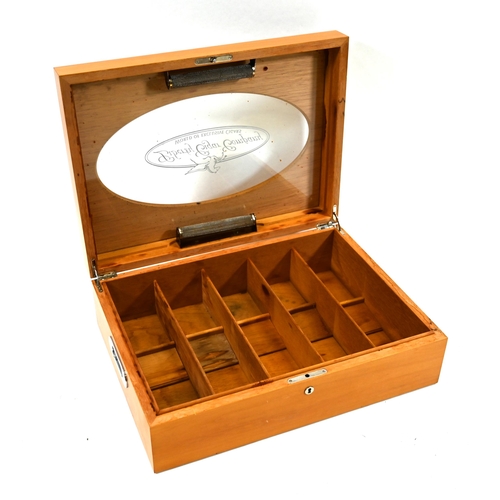 978 - A large fruitwood display humidor, the hinged lid having an oval cut out within which a glass viewin... 