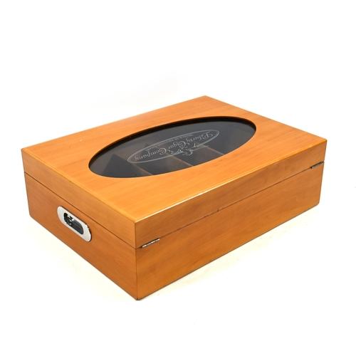 978 - A large fruitwood display humidor, the hinged lid having an oval cut out within which a glass viewin... 