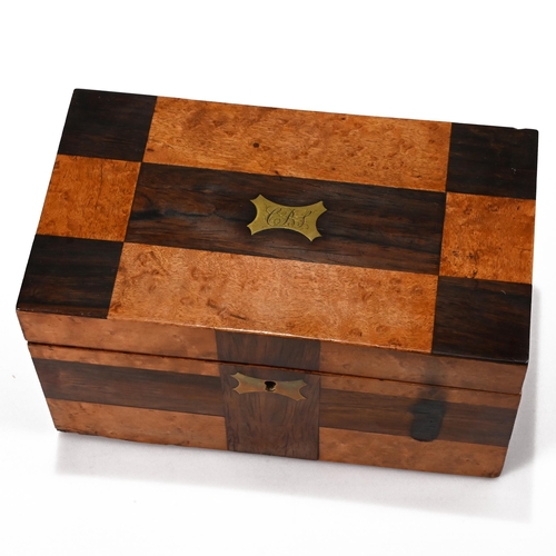 986 - A small two compartment late Victorian tea caddy of burr walnut and cross and rosewood veneer in a c... 