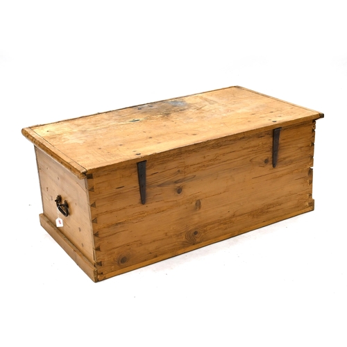 988 - A large sized 19th Century stripped pine trunk with iron handles and hinges. Opens to reveal large o... 