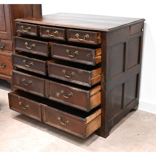 990 - An early 18th Century chest of drawers with 3 over 4 over 2 drawers (9). Deep drawers with moulded f... 