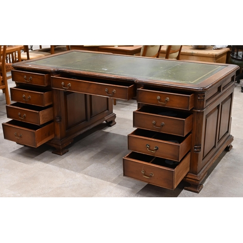 994 - A Victorian revival walnut partners desk with pilaster detailing and green leather skiver c1960's. N... 