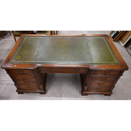 994 - A Victorian revival walnut partners desk with pilaster detailing and green leather skiver c1960's. N... 