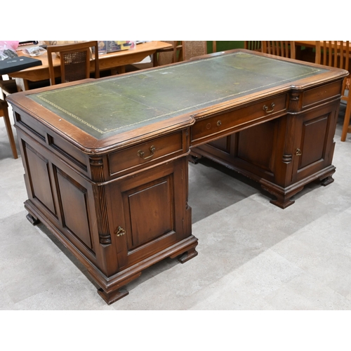 994 - A Victorian revival walnut partners desk with pilaster detailing and green leather skiver c1960's. N... 