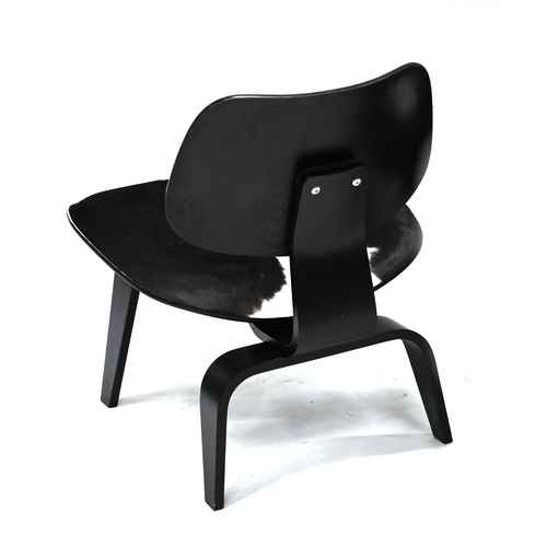 946 - A Vitra Eames LCW Calf's skin lounge chair with black Ash frame.  Designed by Charles & Ray Eames in... 