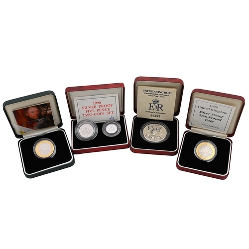 104 - Group of four (4) 1990s and early 2000s Royal Mint silver proof coins and sets in original boxes wit... 