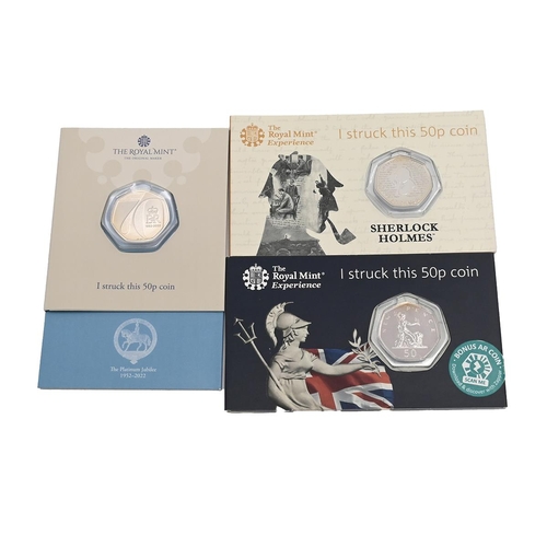 124 - Group of three (3) 'Strike Your Own' Royal Mint UK coins in their original cards. Includes (1) 2019 ... 