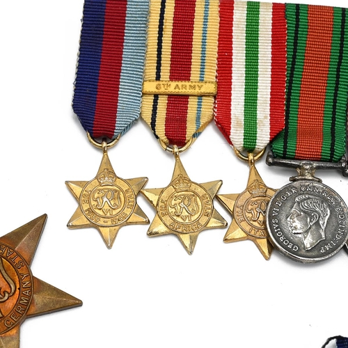 164 - WW2 UK medals. Medals on bar inc miniatures- 1939-45 Star, Africa Star with 8h Army bar, Italy Star,... 