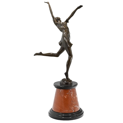 191 - After Bruno Zach - an Art Deco stye bronze figure of a leaping dancer mounted on a conical form red ... 