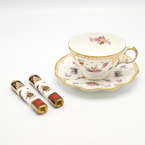 200 - A Royal Crown Derby Royal Antoinette pattern cup and saucer and a pair of  Royal Crown Derby cutlery... 