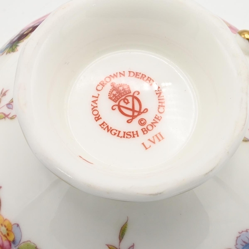 200 - A Royal Crown Derby Royal Antoinette pattern cup and saucer and a pair of  Royal Crown Derby cutlery... 