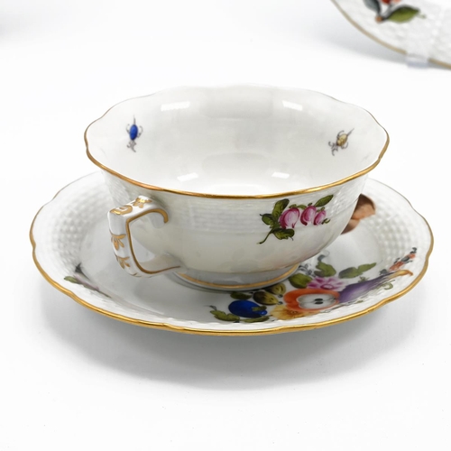 210 - Two Herend fruit and flowers patterned plates and a similar cup and saucer. (4)