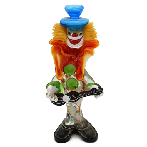 213 - A Murano glass polychrome figure of a clown playing.a guitar (H 29cm) and five Lladro figures: Long ... 