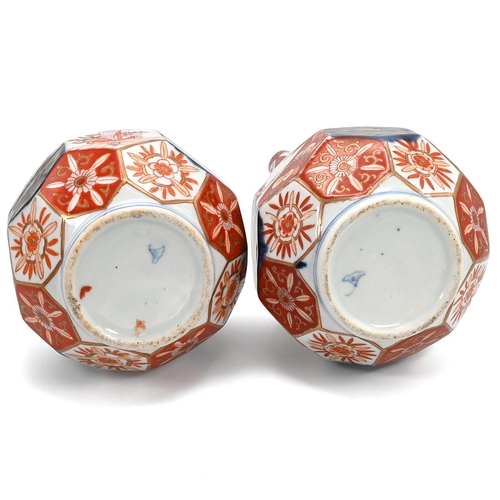 223 - Pair of Meiji Period Japanese Imari Bottle Vases with octagonal faceted bowls and slender tapering n... 