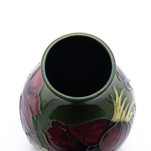 225 - Walter Moorcroft mid 20th Century pottery comprising : a bulbous vase with tube lined Anemone patter... 