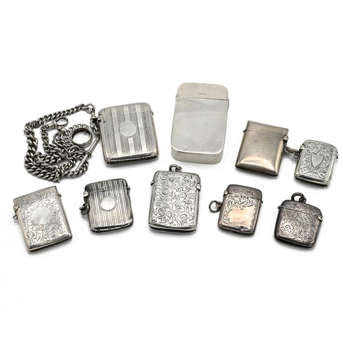 23 - A collection of 8 silver vesta cases, along with a silver fob chain and silver case with a plastic i... 