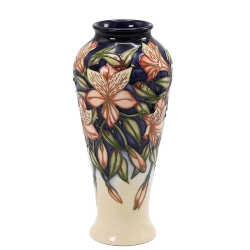 234 - Moocroft Peruvian Lily slender baluster form vase by Sian Leeper, 2004. Size/Shape: 122/8. Height 21... 