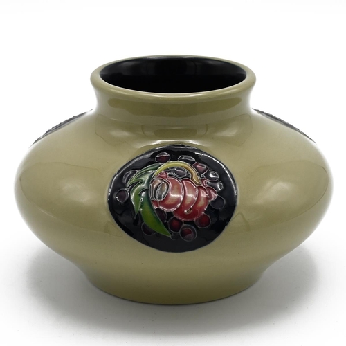 251 - Moorcroft pottery trial piece, 2013. Celadon ground with three midnight blue discs containing tube l... 