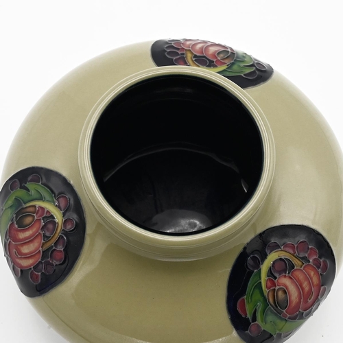 251 - Moorcroft pottery trial piece, 2013. Celadon ground with three midnight blue discs containing tube l... 