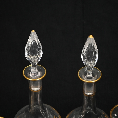 271 - A pair of slender teardrop shaped 19th century continental liqueur or cordial decanters with gilt en... 