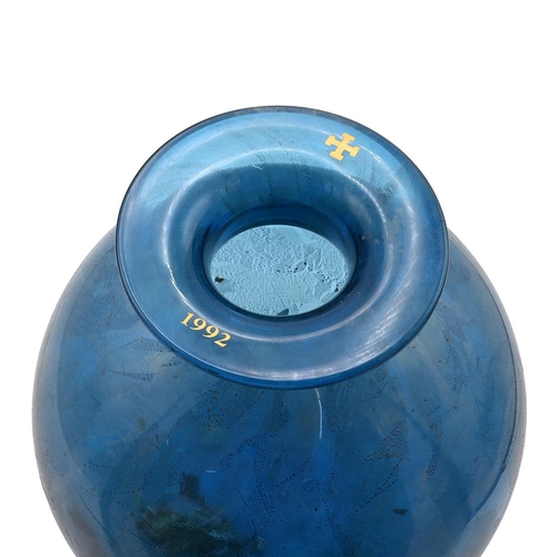 283 - An Isle of Wight spherical glass vase with flared rim marked with a cross and 1992, blue ground with... 