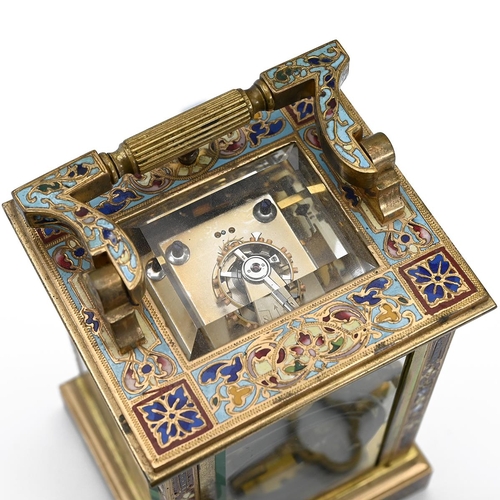 305 - A Late 19th Century French eight day, two train, repeating carriage clock in gilded brass and Champl... 