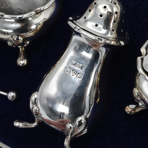 37 - A silver three piece cruet set, along with a pair of silver miniature easel frames, 134 grams 