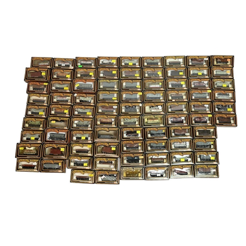 411 - Quantity of boxed Palitoy Mainline 00 gauge Model Railway wagons. All LMS colours. (approx 82) 