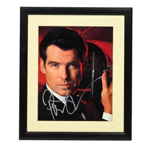 505 - Signed Pierce Brosnan as James Bond 007 photograph. Certificate of Authenticity to reverse. W 29cm, ... 