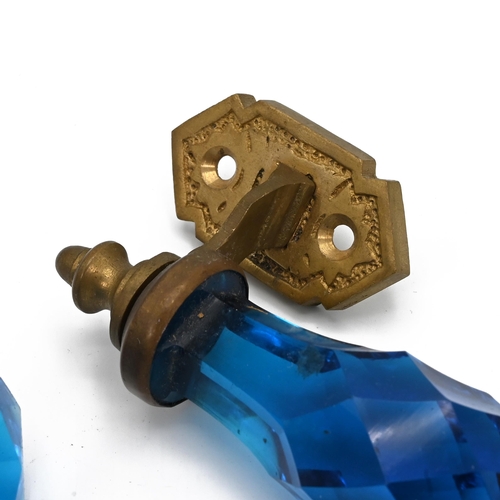 526 - A set of brass and faceted glass handles and matching door knobs 