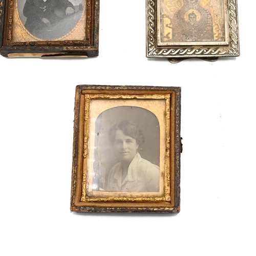 542 - A 19th century daguerreotype photograph of a gentlemen, along with a silver photograph frame with an... 