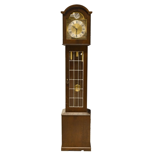 56 - An Oak longcase Grandmother clock by Pallesgaard of Copenhagen with three train movement, brass dial... 