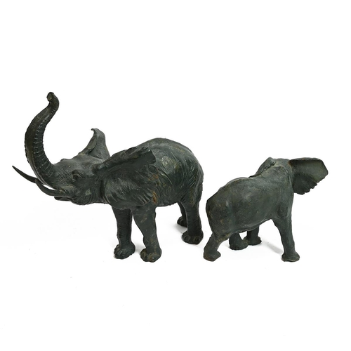 566 - 20th Century - A Mother and Baby Elephant, the mother trumpeting, cast iron with green patina, the f... 