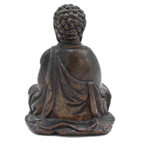 572 - A bronze Chinese Buddha holding a coin, 9cm x 6cm x 5.5cm