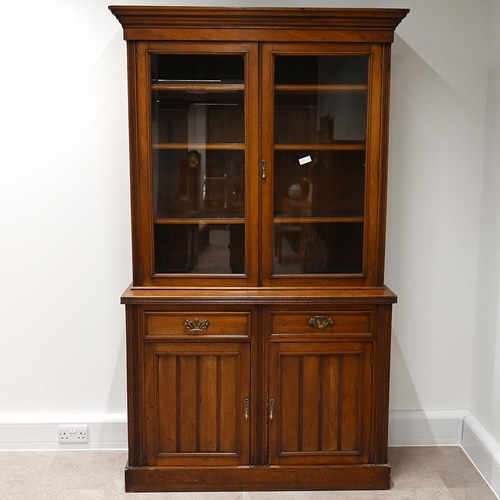 585 - Edwardian glazed oak bookcase, the upper part a stepped pediment over  two glazed doors, with brass ... 