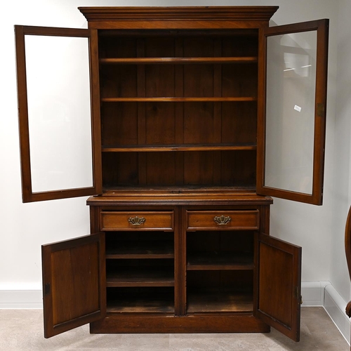 585 - Edwardian glazed oak bookcase, the upper part a stepped pediment over  two glazed doors, with brass ... 