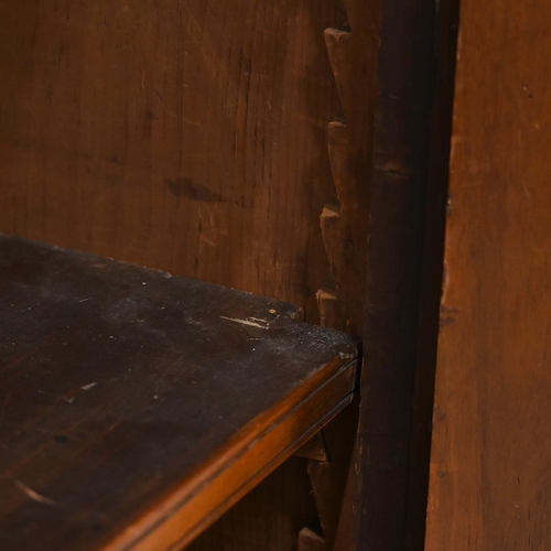 585 - Edwardian glazed oak bookcase, the upper part a stepped pediment over  two glazed doors, with brass ... 