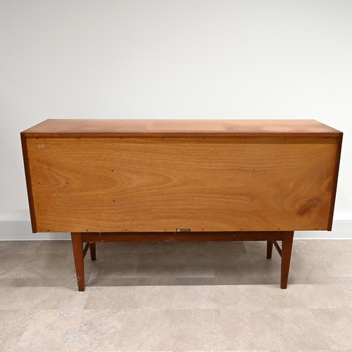 588 - A Mid-Century Gordon Russell teak sideboard with three long drawers, one with felt lined cutlery tra... 